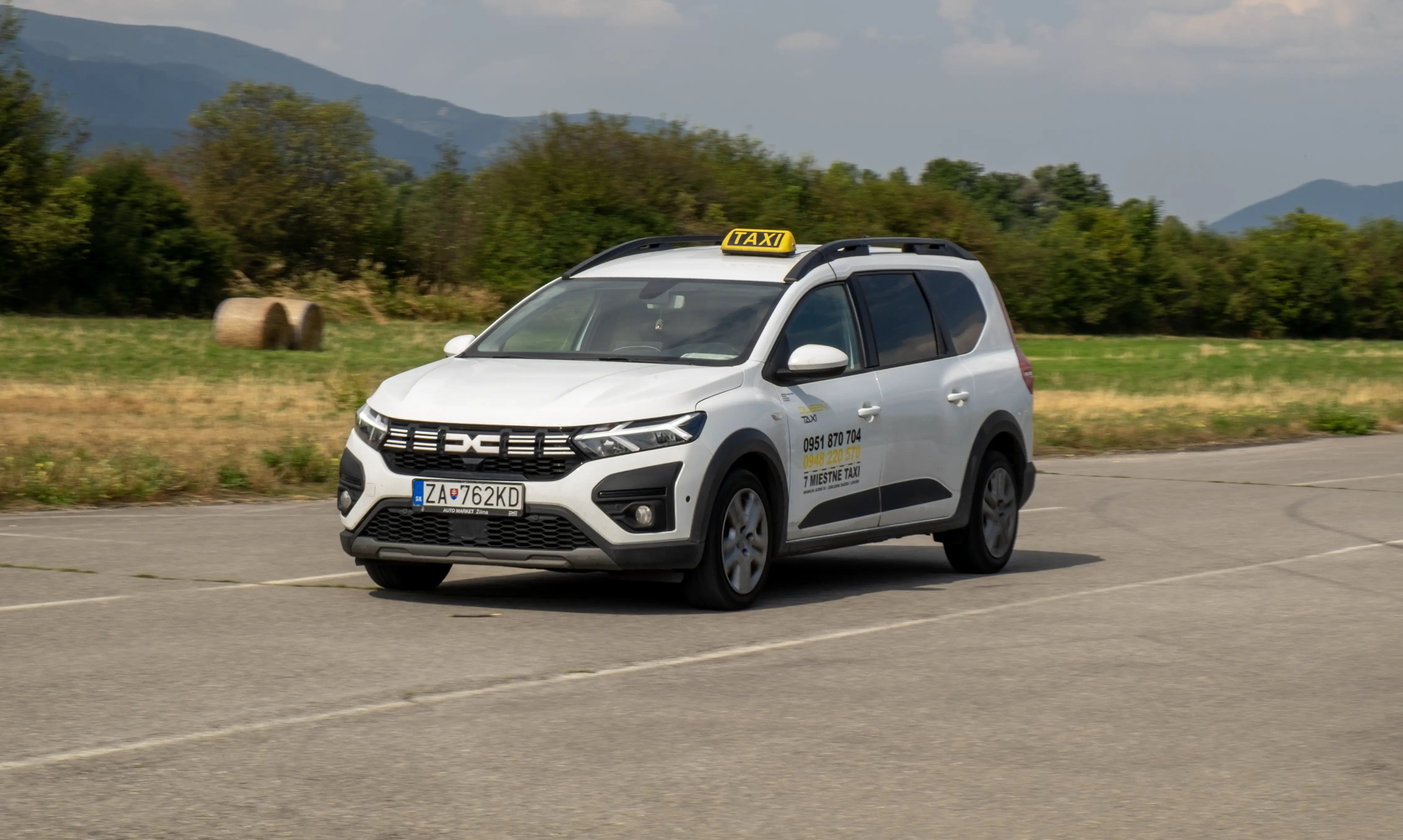 White 7-seat Dacia Jogger taxi marked Taxi Dubeň
